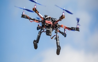 Flying drone with camera attachment