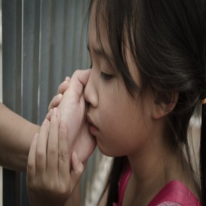 Daughter holding the hands of her mother