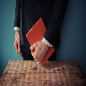 Man with book at desk