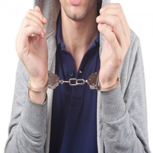 young man in handcuffs